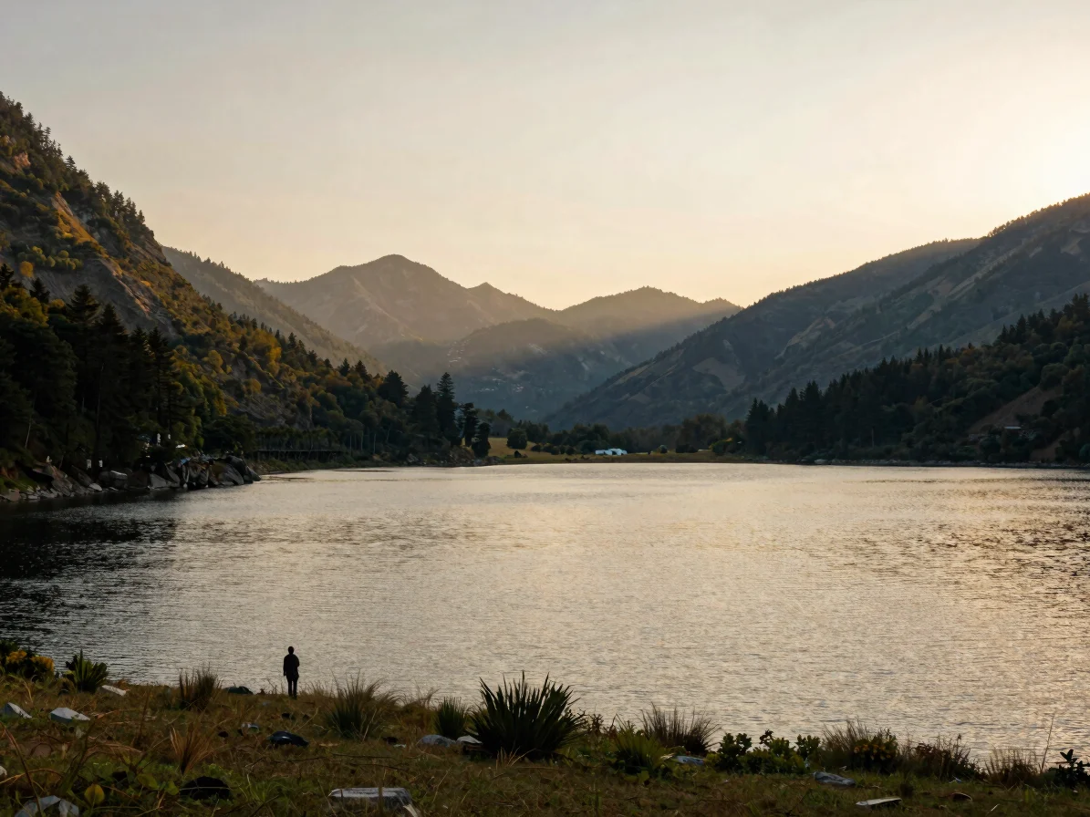 Wide panoramic shot of a serene mountain lake at golden hour, sof